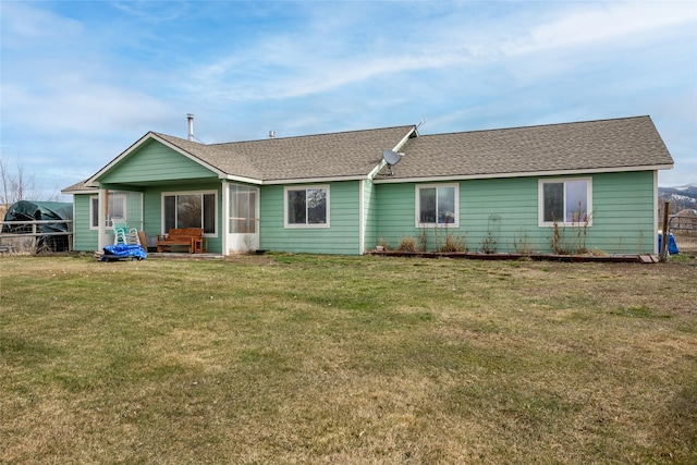 552 Pat Ln, Stevensville, MT 59870 - back of house with a lawn and a shingled roof