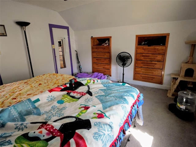 bedroom with lofted ceiling and carpet