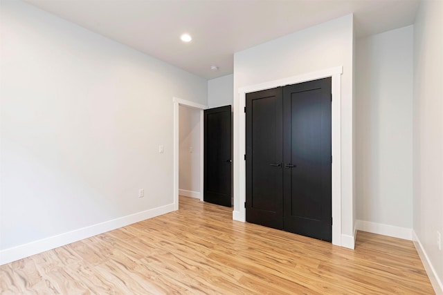 2212 S 12th St W, Missoula, MT 59801 - unfurnished bedroom with light wood finished floors, baseboards, a closet, and recessed lighting
