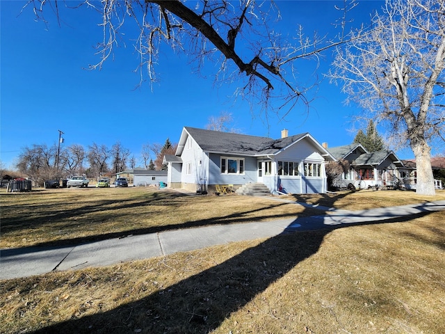 exterior space featuring a front yard