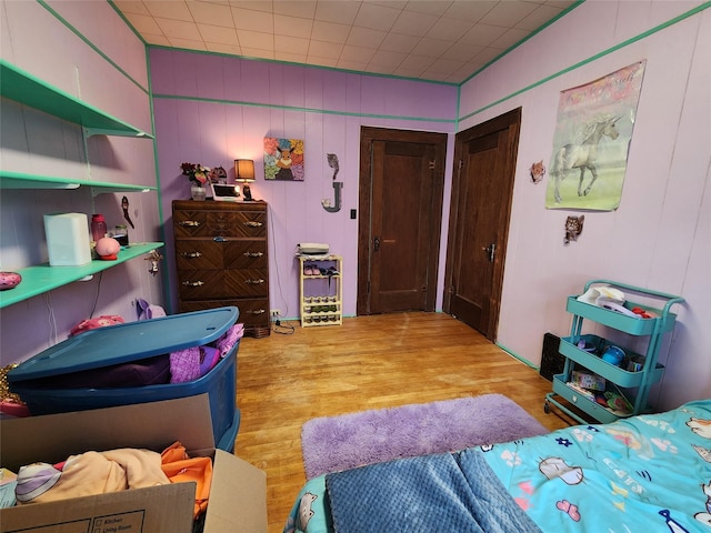 bedroom with wood finished floors