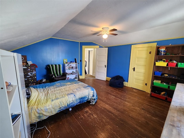bedroom featuring baseboards, lofted ceiling, a ceiling fan, and hardwood / wood-style flooring