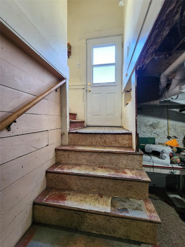 stairway with wooden walls