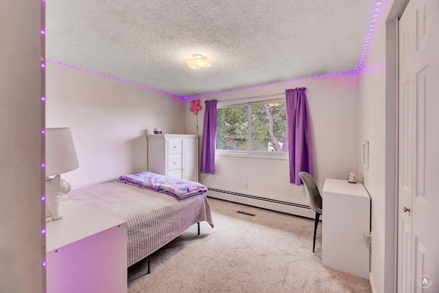 1565 Beaverhead Rd, Helena, MT 59602 - bedroom with a baseboard radiator, a textured ceiling, and carpet floors
