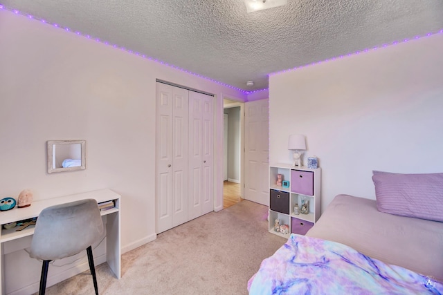1565 Beaverhead Rd, Helena, MT 59602 - carpeted bedroom featuring a textured ceiling, a closet, a desk, and baseboards