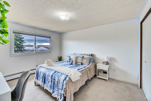 1565 Beaverhead Rd, Helena, MT 59602 - bedroom with a baseboard radiator, light carpet, a textured ceiling, baseboards, and a closet