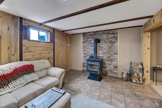 1565 Beaverhead Rd, Helena, MT 59602 - living room with wooden walls, a wood stove, and baseboards