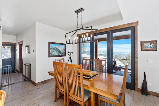 85 Meadows Dr, Whitefish, MT 59937 - dining room with light wood-style floors and a chandelier
