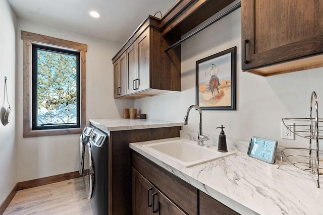 85 Meadows Dr, Whitefish, MT 59937 - laundry area featuring cabinet space, independent washer and dryer, light wood-style floors, and recessed lighting