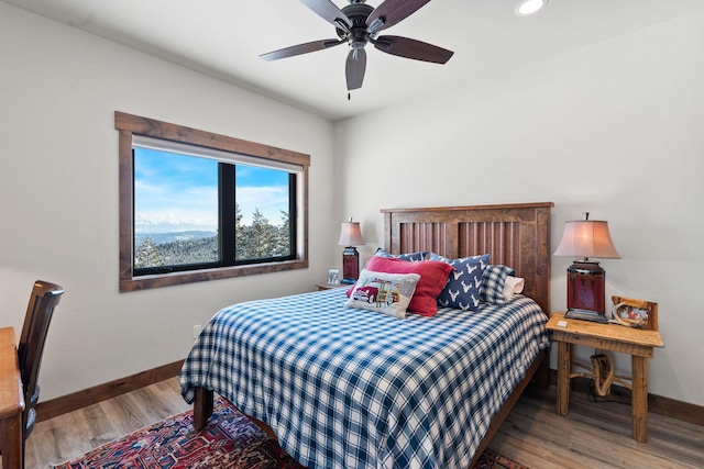 85 Meadows Dr, Whitefish, MT 59937 - bedroom with wood finished floors, recessed lighting, and a ceiling fan