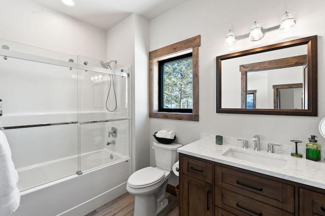 85 Meadows Dr, Whitefish, MT 59937 - full bath with vanity, wood finished floors, and combined bath / shower with glass door