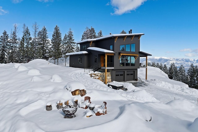 85 Meadows Dr, Whitefish, MT 59937 - view of front of property featuring an attached garage and board and batten siding