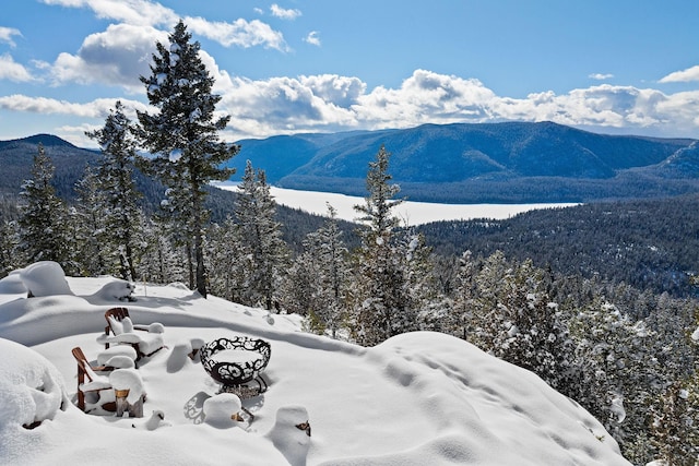 85 Meadows Dr, Whitefish, MT 59937 - view of mountain background with a heavily wooded area and a large body of water