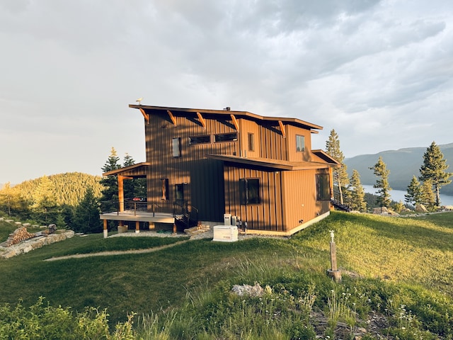 85 Meadows Dr, Whitefish, MT 59937 - rear view of house featuring a yard and a mountain view
