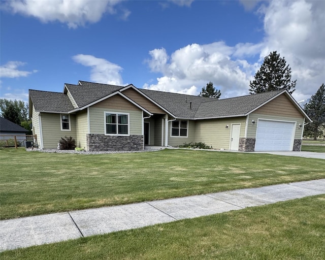 369 Gold Ct, Florence, MT 59833 - view of front facade with stone siding, a garage, driveway, and a shingled roof