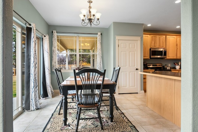 369 Gold Ct, Florence, MT 59833 - dining room with plenty of natural light, light tile patterned floors, recessed lighting, and a chandelier