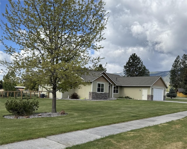 369 Gold Ct, Florence, MT 59833 - single story home featuring a front yard, an attached garage, and roof with shingles