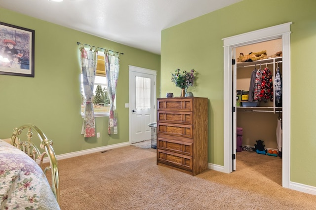 369 Gold Ct, Florence, MT 59833 - bedroom with a spacious closet, carpet floors, a closet, and baseboards