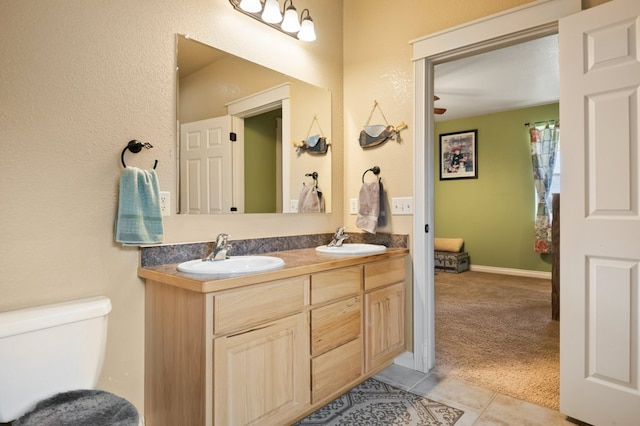 369 Gold Ct, Florence, MT 59833 - full bathroom with double vanity, toilet, and tile patterned floors