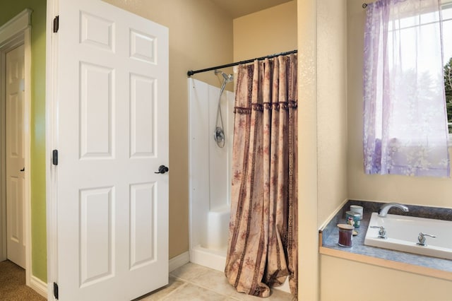 369 Gold Ct, Florence, MT 59833 - full bathroom featuring a stall shower, a bath, and tile patterned floors