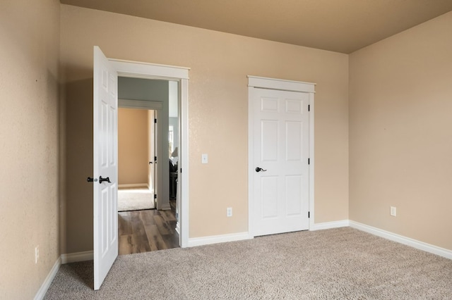 369 Gold Ct, Florence, MT 59833 - unfurnished bedroom with carpet floors and baseboards