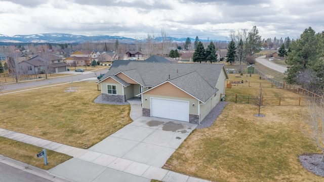 369 Gold Ct, Florence, MT 59833 - view of front facade with a garage, concrete driveway, stone siding, a residential view, and roof with shingles