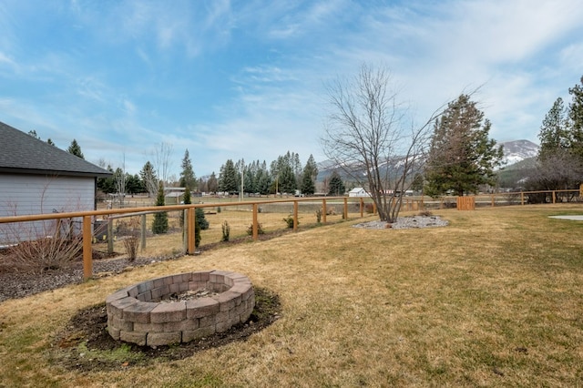 369 Gold Ct, Florence, MT 59833 - view of yard featuring an outdoor fire pit and a mountain view