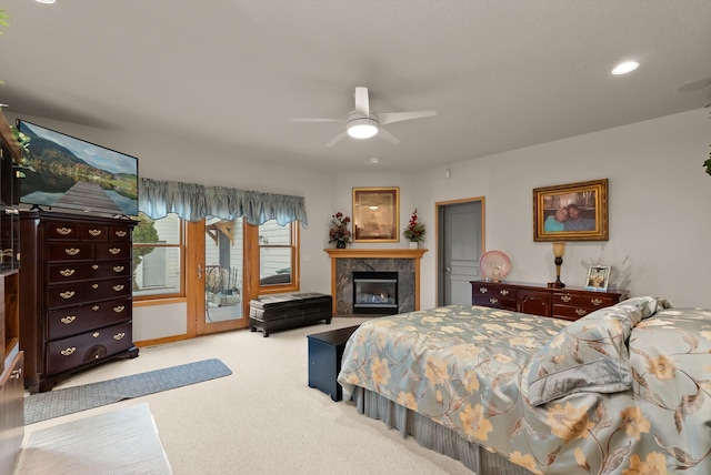 229AND231 Harbor Dr, Bigfork, MT 59911 - carpeted bedroom featuring access to outside, a fireplace, recessed lighting, and ceiling fan