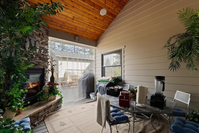 229AND231 Harbor Dr, Bigfork, MT 59911 - sunroom featuring lofted ceiling and an outdoor stone fireplace