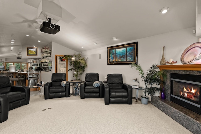 229AND231 Harbor Dr, Bigfork, MT 59911 - carpeted home theater room with lofted ceiling, a fireplace, recessed lighting, and a ceiling fan