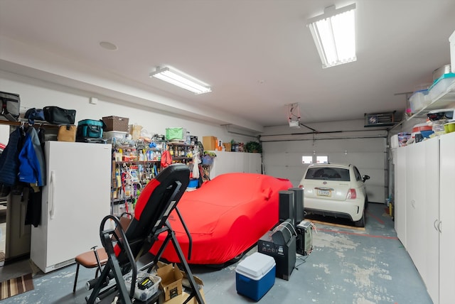 229AND231 Harbor Dr, Bigfork, MT 59911 - garage with a garage door opener and freestanding refrigerator