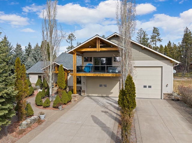 229AND231 Harbor Dr, Bigfork, MT 59911 - view of front of house featuring a balcony, stone siding, a garage, driveway, and a shingled roof