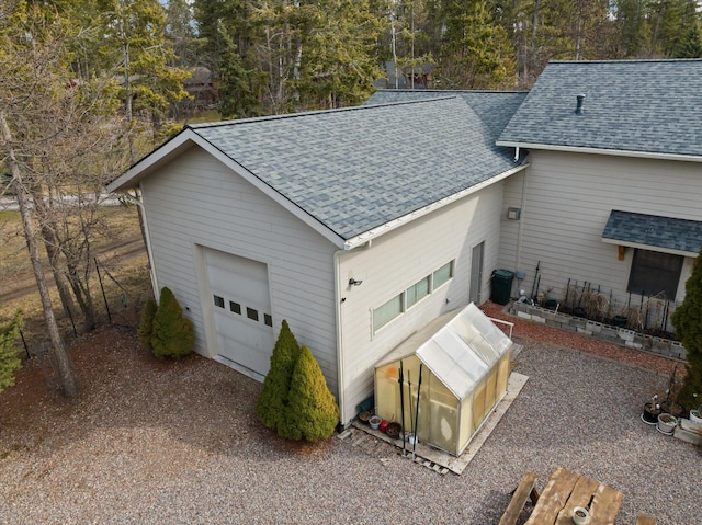 229AND231 Harbor Dr, Bigfork, MT 59911 - garage with view of scattered trees