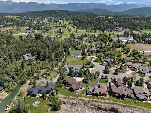 229AND231 Harbor Dr, Bigfork, MT 59911 - aerial view of property and surrounding area with mountains and nearby suburban area
