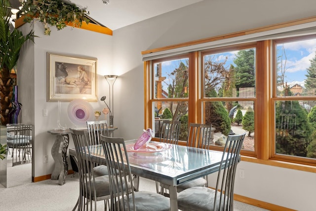 229AND231 Harbor Dr, Bigfork, MT 59911 - dining room featuring vaulted ceiling and carpet floors