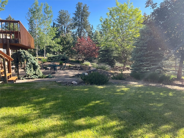 19066 King Rd, Florence, MT 59833 - view of green lawn featuring a patio