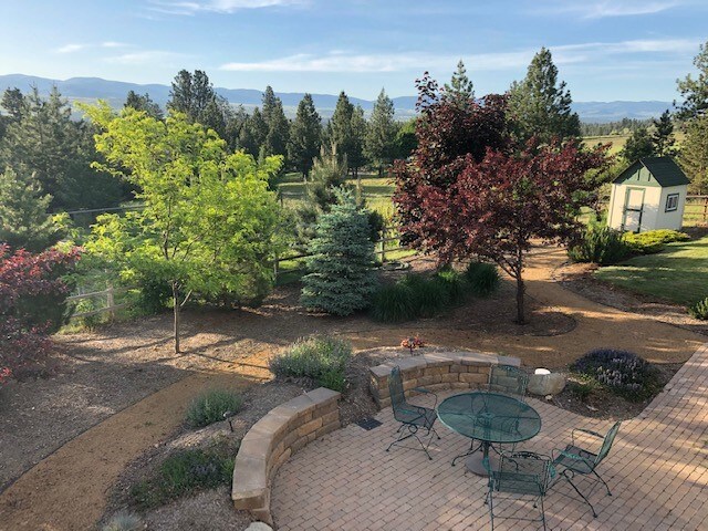 19066 King Rd, Florence, MT 59833 - view of patio with an outdoor structure and a storage shed
