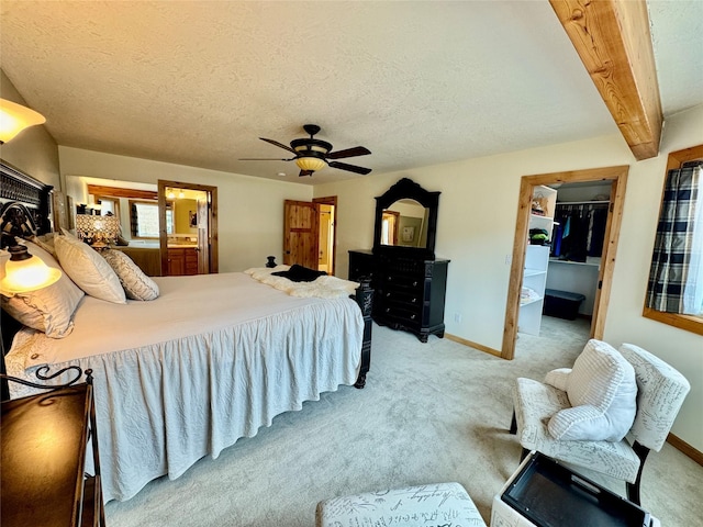 19066 King Rd, Florence, MT 59833 - bedroom featuring light colored carpet, beamed ceiling, a spacious closet, and a textured ceiling