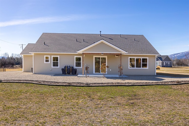 376 Cowboy Ct, Florence, MT 59833 - back of house with a patio and a lawn