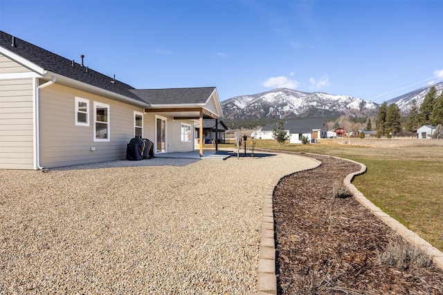 376 Cowboy Ct, Florence, MT 59833 - view of grassy yard with a mountain view and a patio area