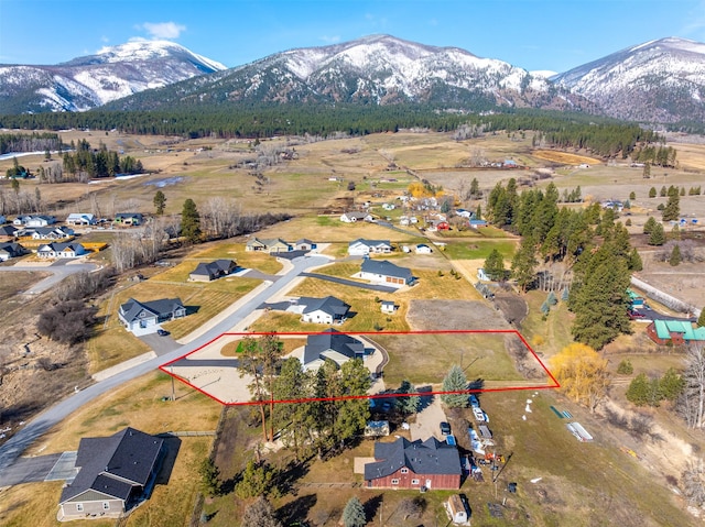 376 Cowboy Ct, Florence, MT 59833 - aerial view of property and surrounding area with property boundaries highlighted and mountains