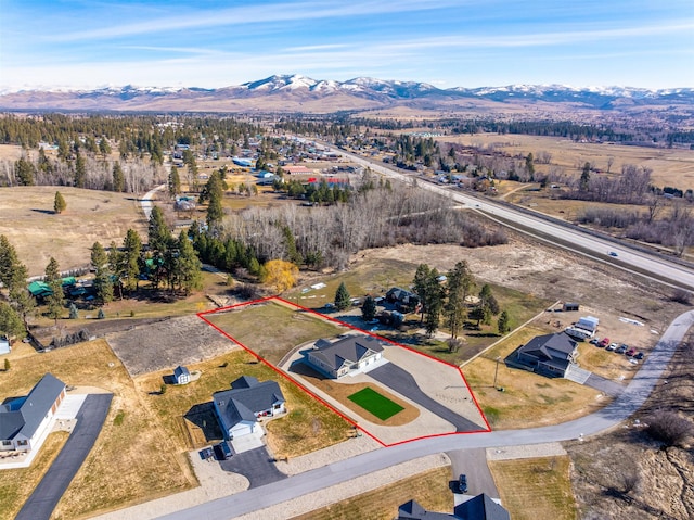 376 Cowboy Ct, Florence, MT 59833 - aerial overview of property's location with property boundaries highlighted and a mountainous background