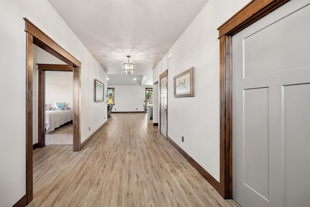 376 Cowboy Ct, Florence, MT 59833 - corridor with a chandelier and light wood finished floors