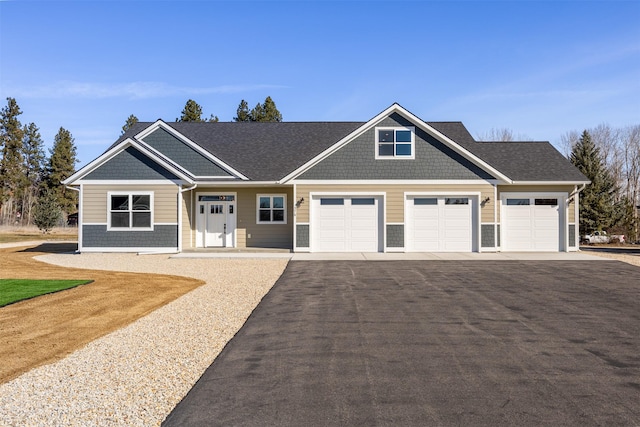 376 Cowboy Ct, Florence, MT 59833 - craftsman-style house with a garage and asphalt driveway
