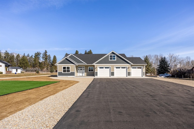 376 Cowboy Ct, Florence, MT 59833 - view of front of property with driveway, an attached garage, and a front yard