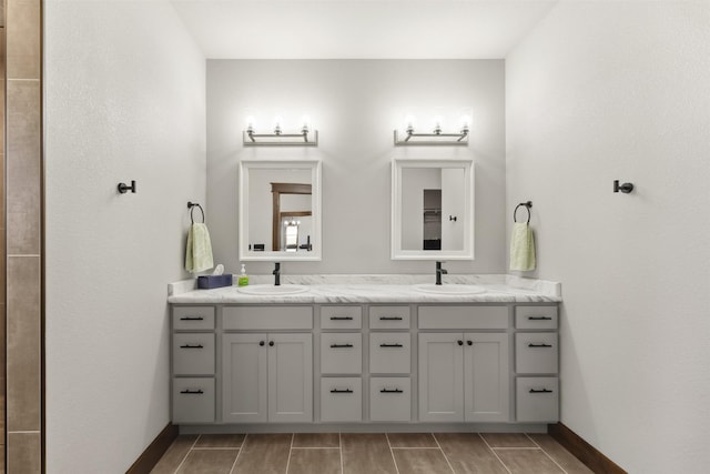 376 Cowboy Ct, Florence, MT 59833 - bathroom with baseboards and double vanity