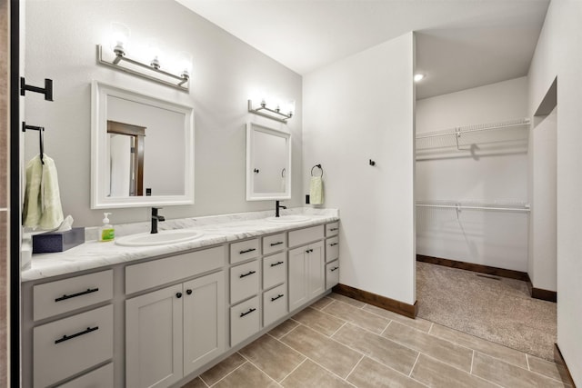 376 Cowboy Ct, Florence, MT 59833 - bathroom featuring double vanity and a walk in closet