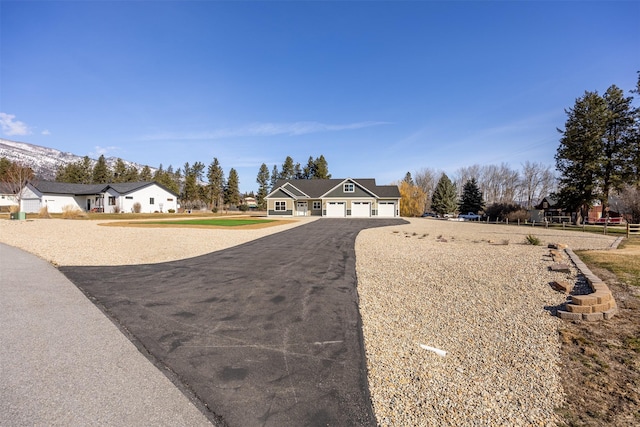 376 Cowboy Ct, Florence, MT 59833 - view of front facade with asphalt driveway and a garage