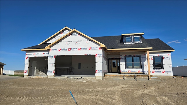 4017 12th St NE, Great Falls, MT 59404 - unfinished property with a shingled roof and a garage