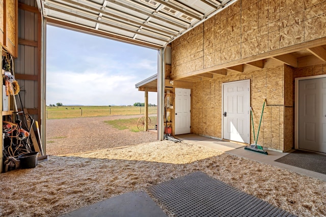garage featuring a rural view